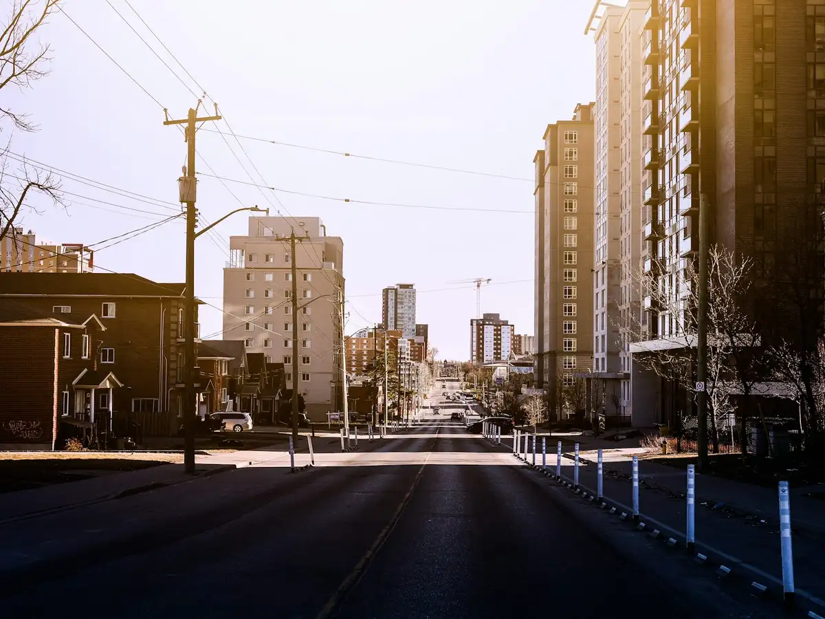Uptown Waterloo condo towers along a wide street