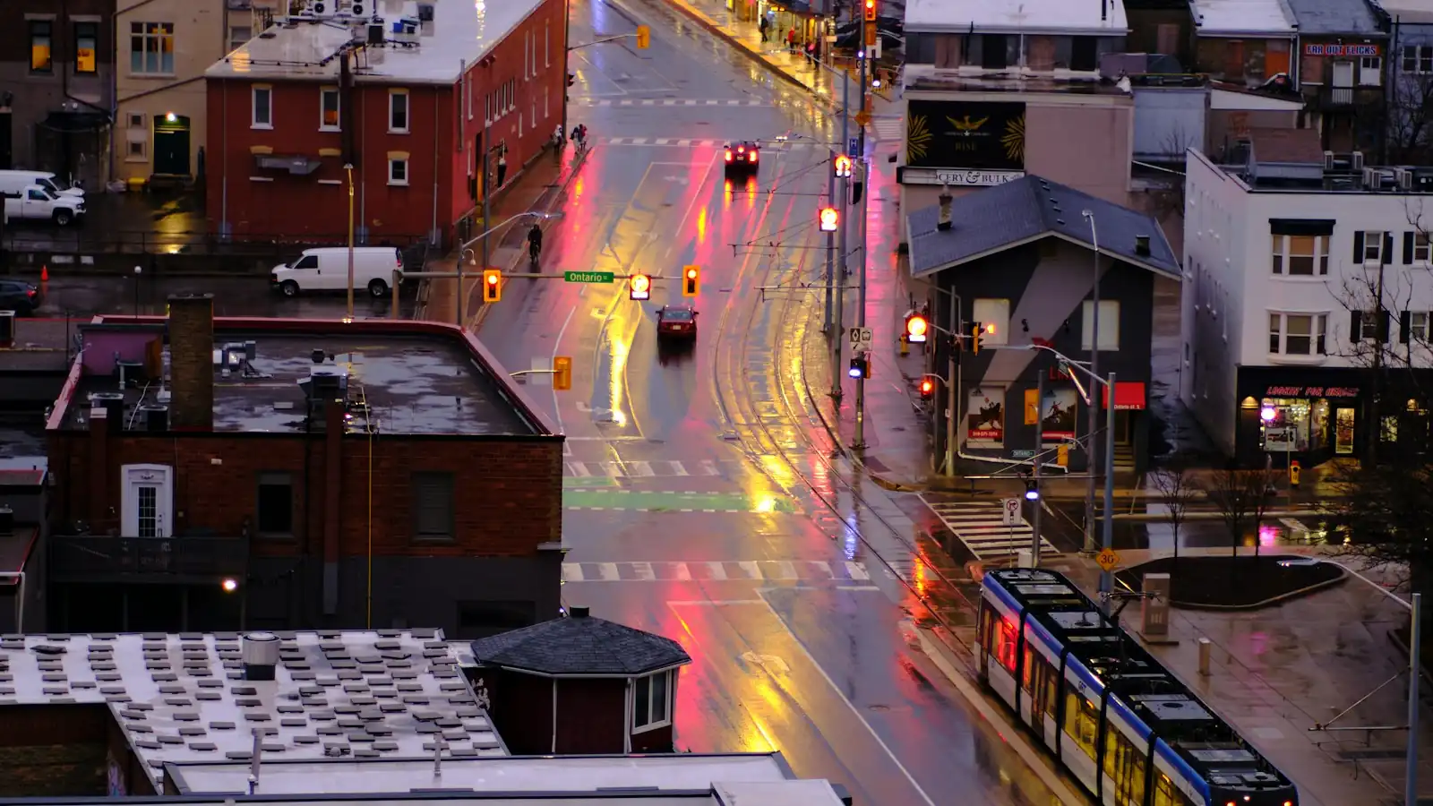 King Street in Kitchener-Waterloo at dusk with an ION light-rail train passing