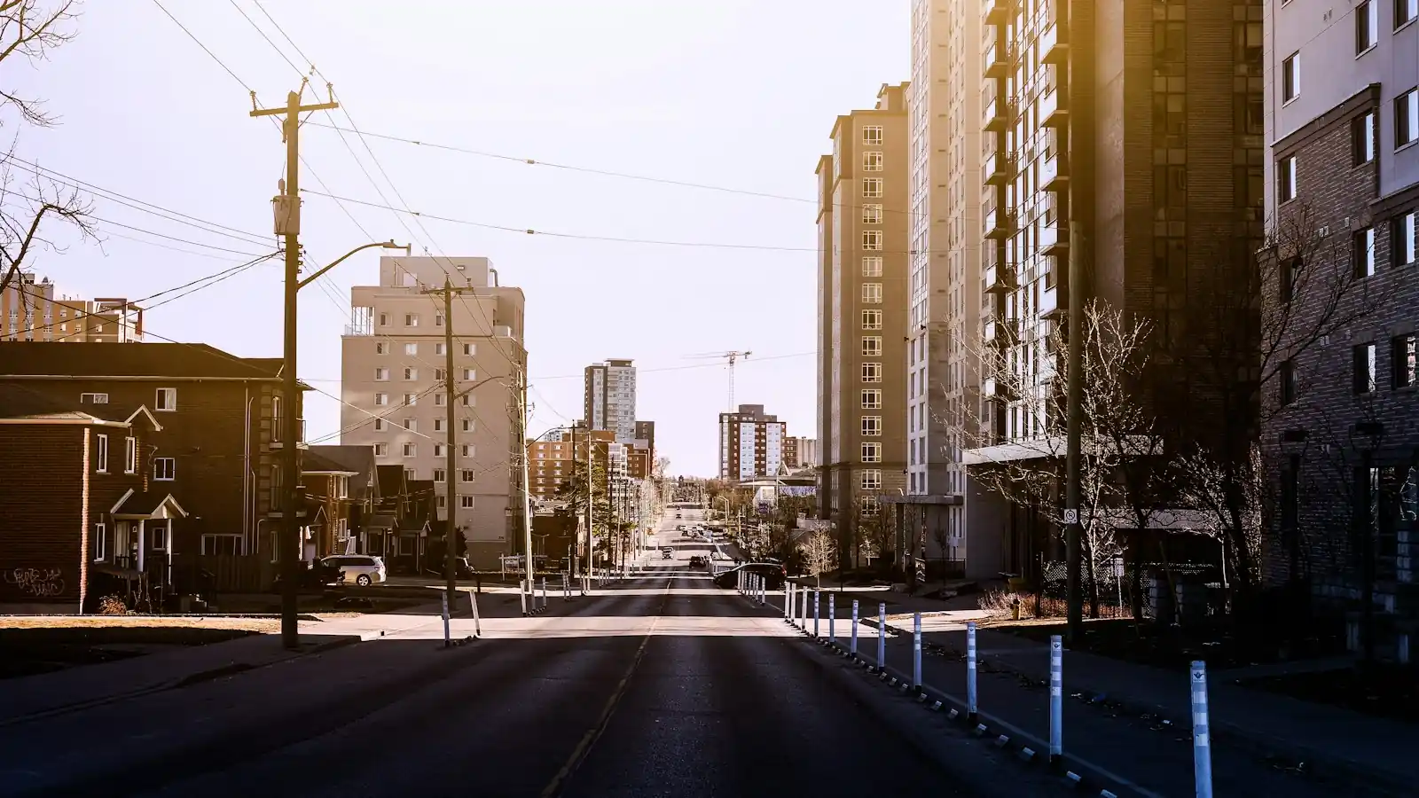 Uptown Waterloo: a road between high-rise condo towers in daytime