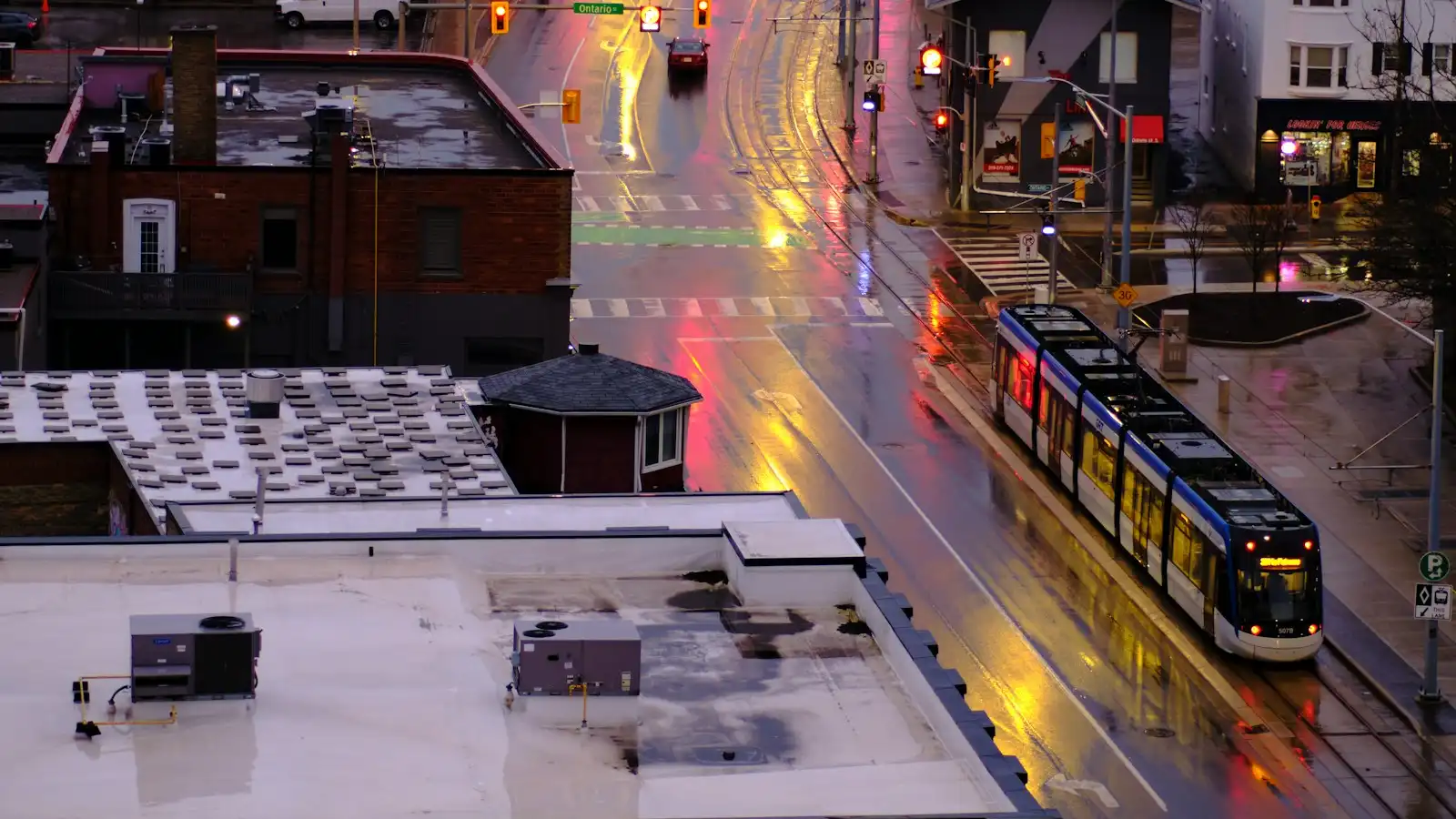 King Street in Kitchener-Waterloo at dusk with an ION light-rail train passing