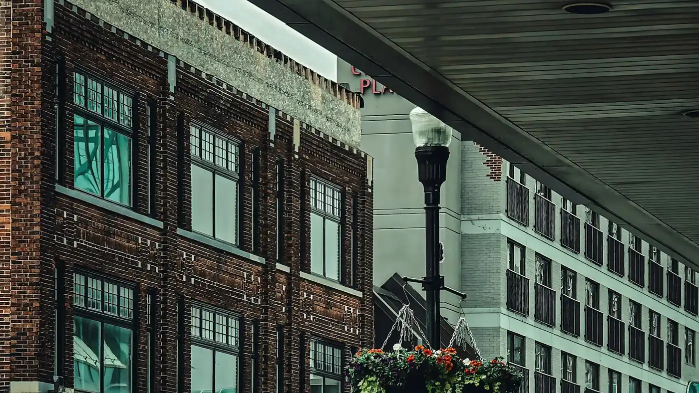 A downtown Kitchener street with brick storefronts and people on the sidewalk