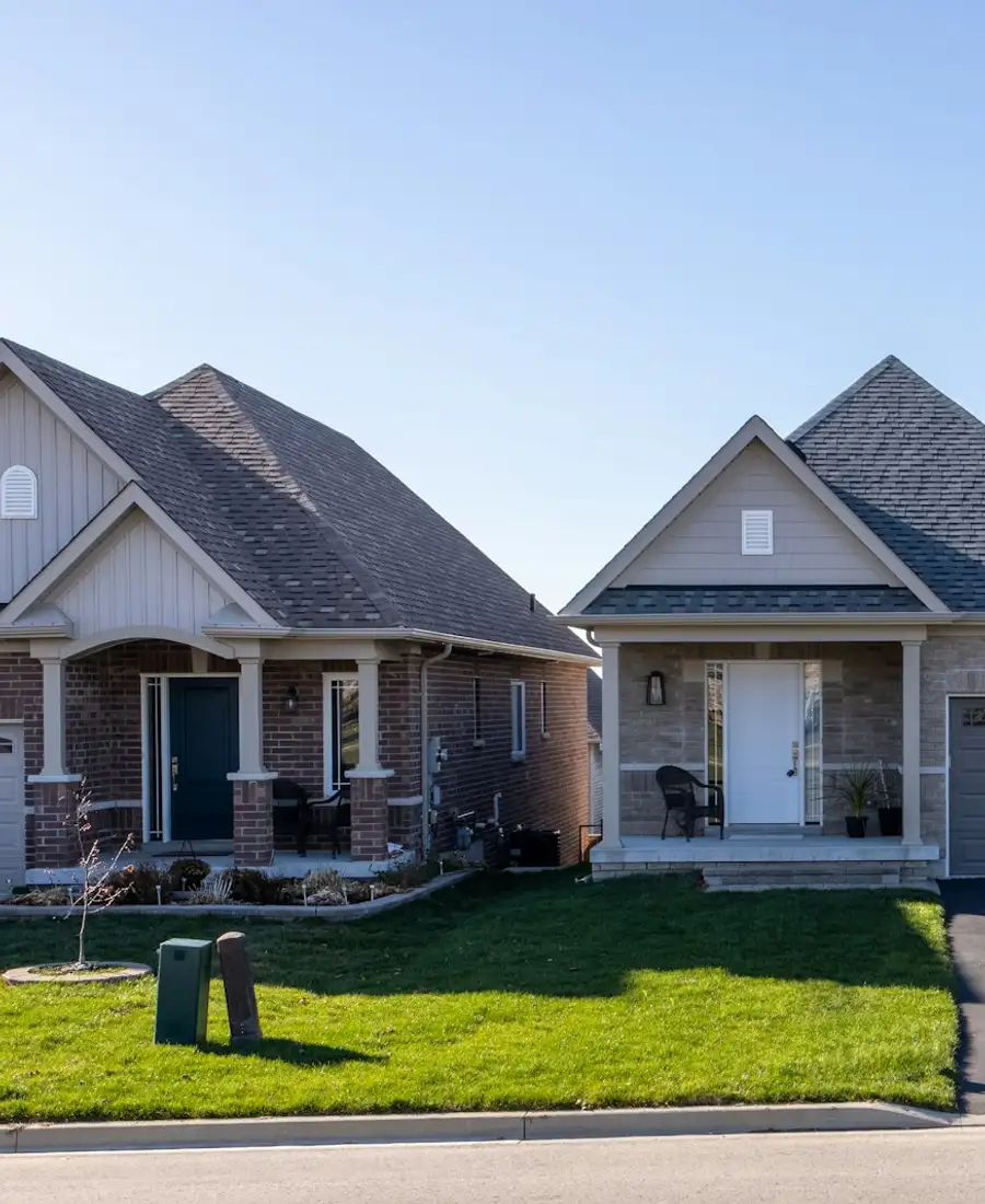 Grey-roofed bungalow on a newly built subdivision street